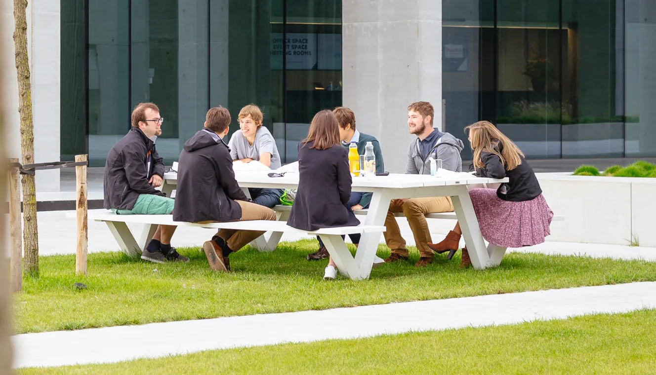 People having a lunch meeting outside